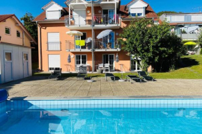 Das Schneckenhaus - Ferienwohnung mit Pool & Seeblick